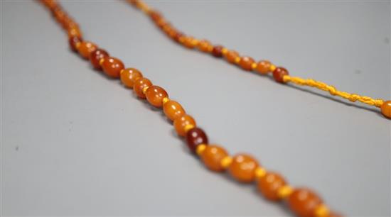 A single strand graduated oval amber bead necklace, 108cm, gross 18 grams.